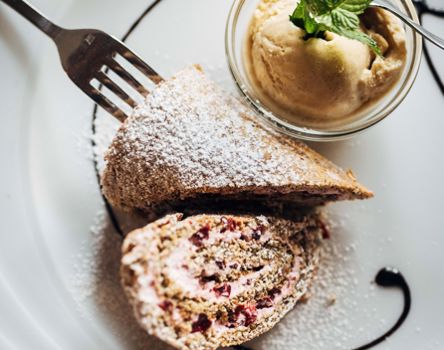 A slice of cake and a scoop of ice cream